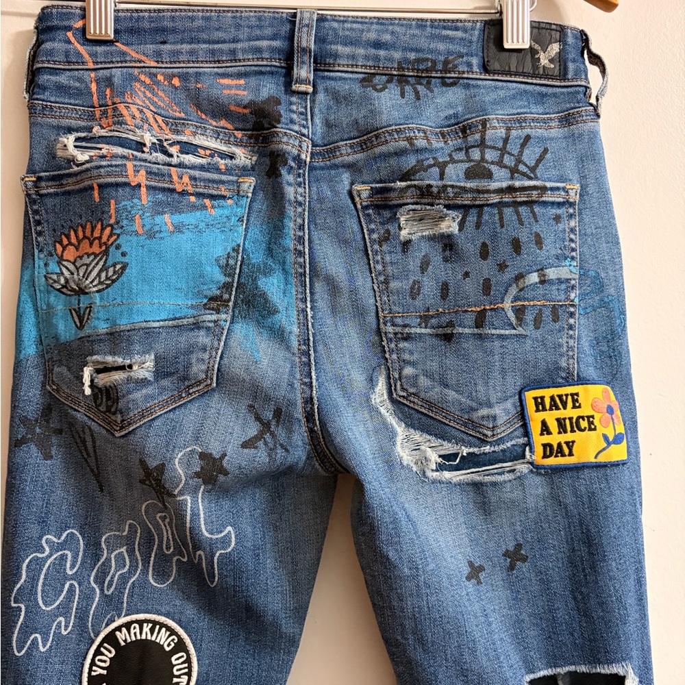 Distressed Blue Graphic Women’s Jeans with Patch & Embroidery - Picture 9 of 10